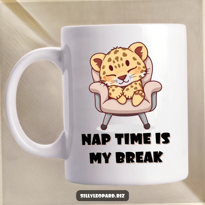 Funny mug featuring a sleepy leopard cub peacefully napping on a plush office chair, evoking comfort and humor for desk jockeys.