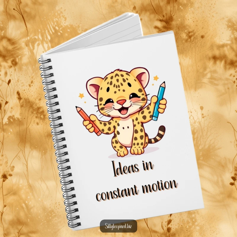Funny notebook featuring a dynamic leopard cub enthusiastically juggling three pens, perfect for capturing ideas with a humorous touch.