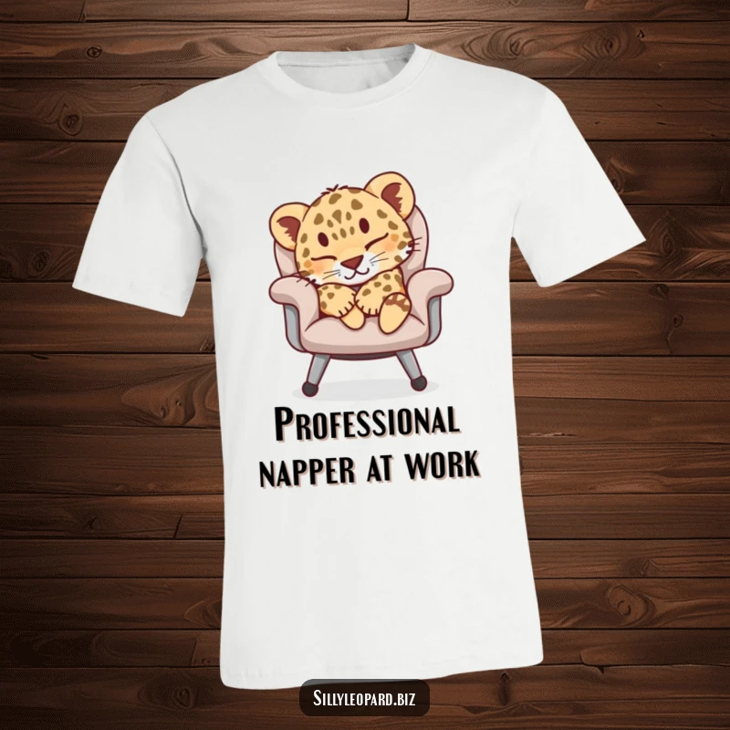 Funny t-shirt depicting a contented leopard cub fast asleep on a luxurious office chair, ideal for relaxation enthusiasts and gift-givers.