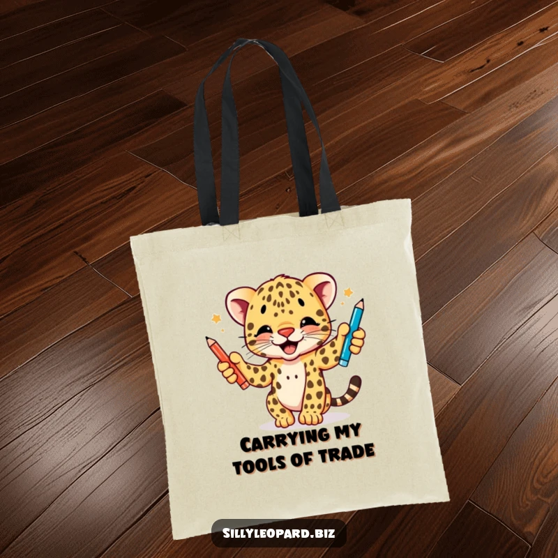 Funny tote bag depicting an animated leopard cub in mid-action, enthusiastically juggling three distinct pens, a practical and humorous accessory.