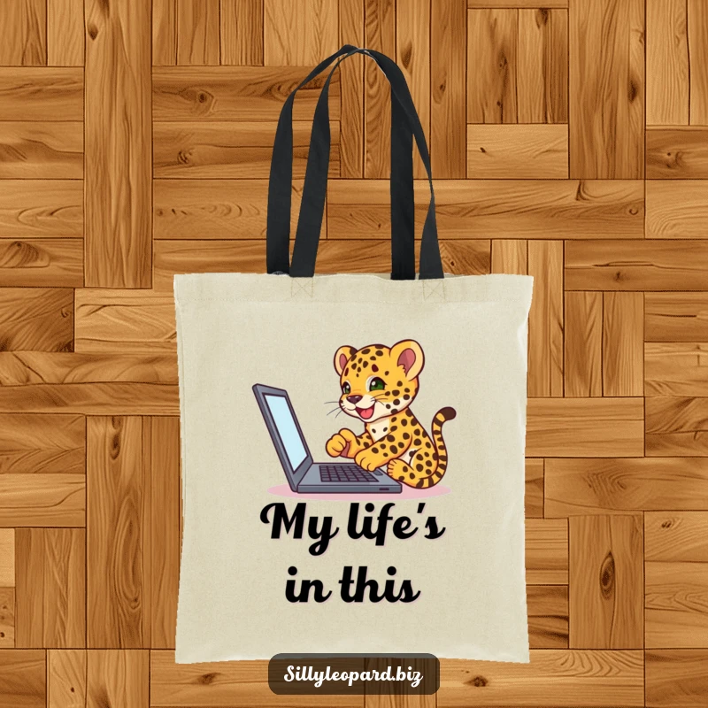 Funny tote bag showing an excited leopard cub tapping on a laptop, perfect for carrying essentials with a tech-humor twist.